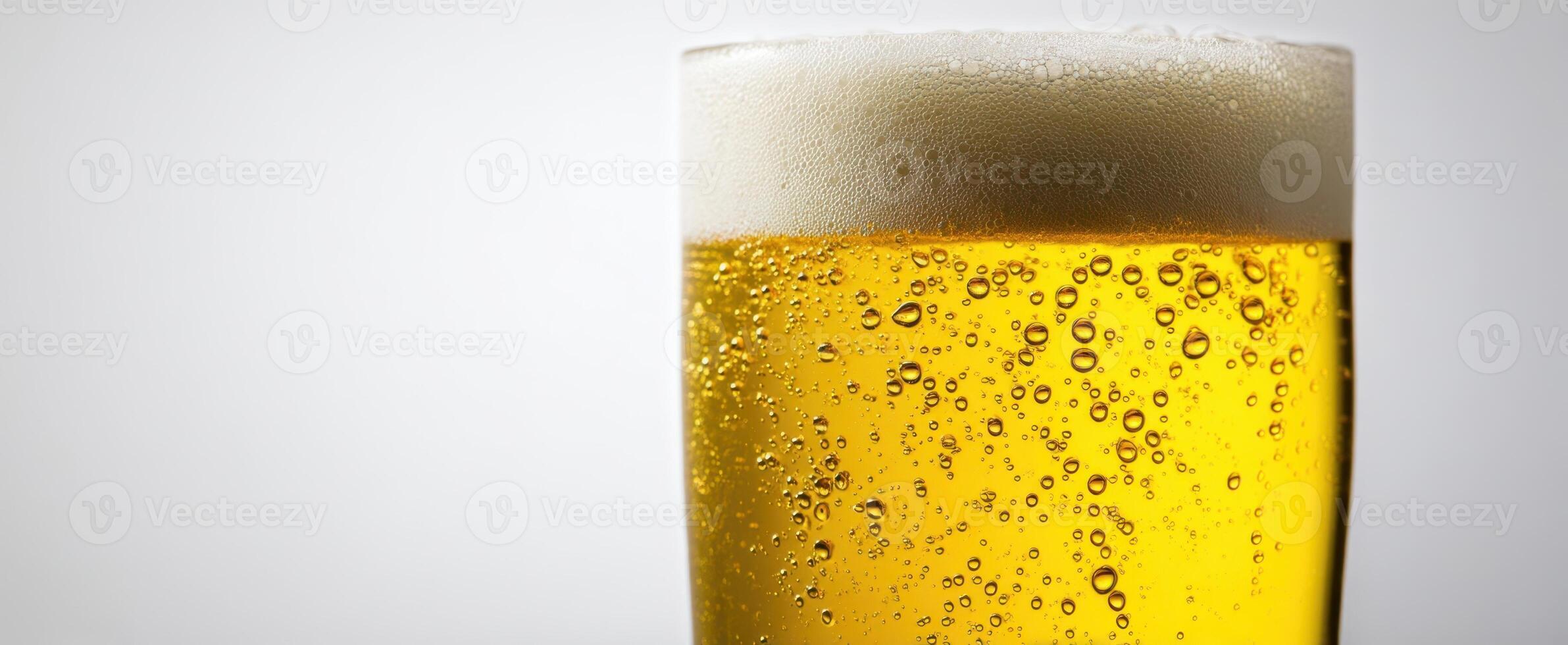 The refreshing glass of beer with frothy foam and sparkling bubbles. photo