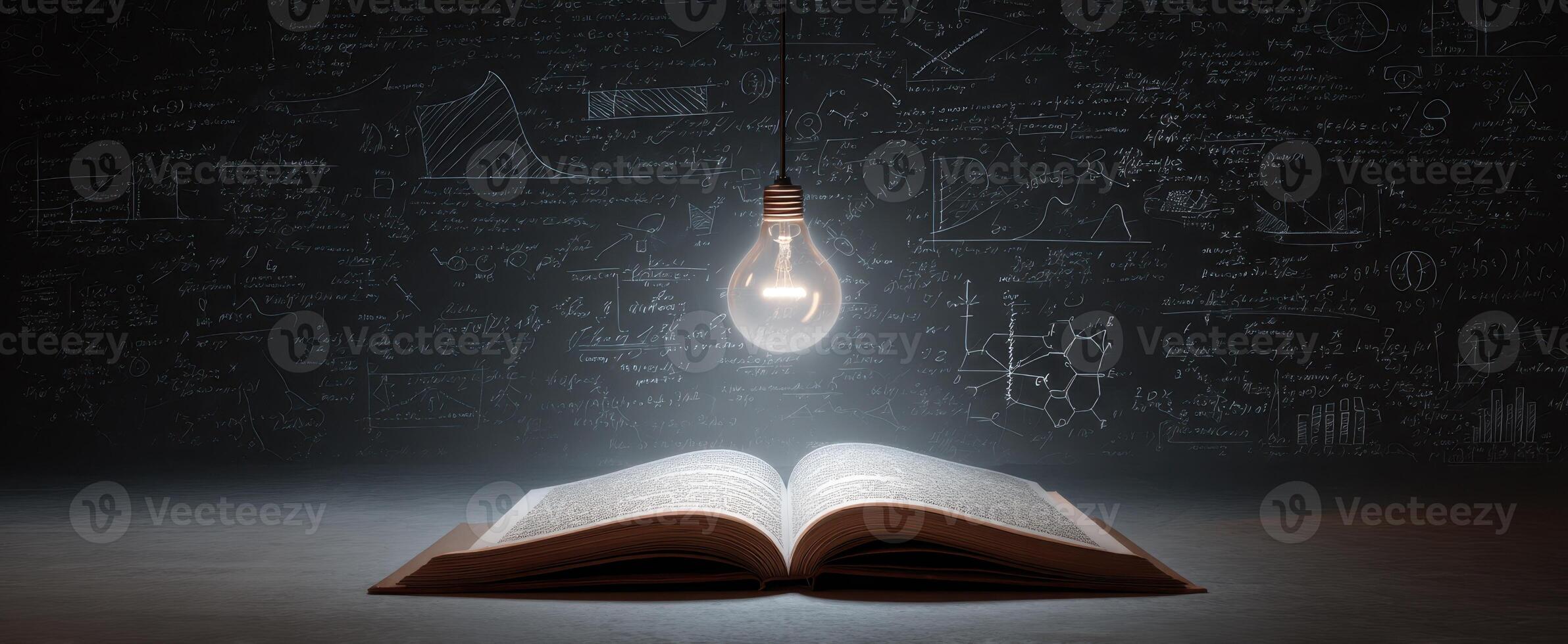 The book illuminated by creativity and scientific inspiration in a dark environment. photo