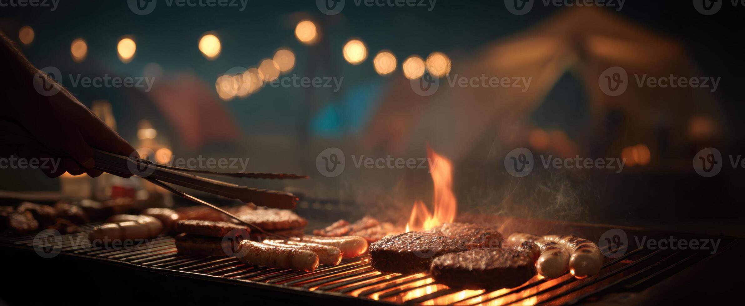 The perfect barbecue experience with grilled sausages and burgers at night. photo