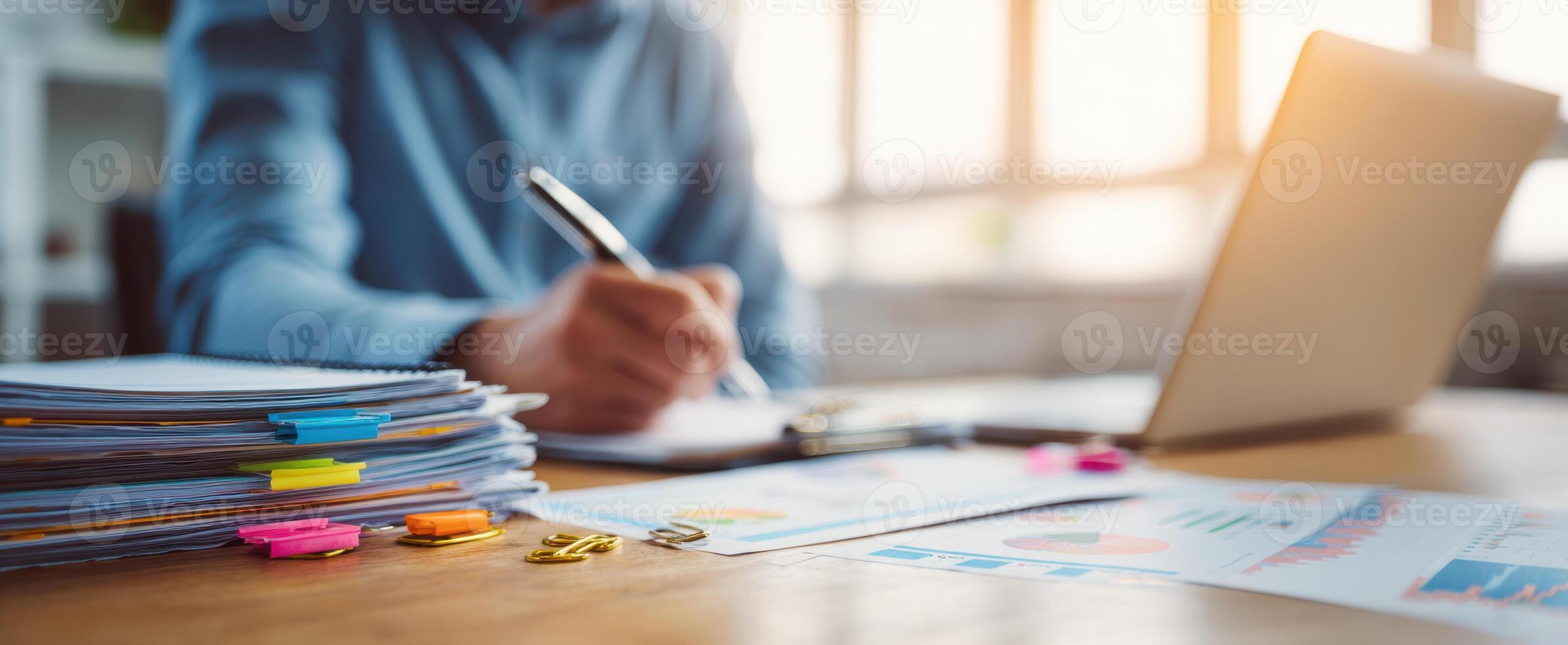 The professional preparing documents in a modern office workspace. photo