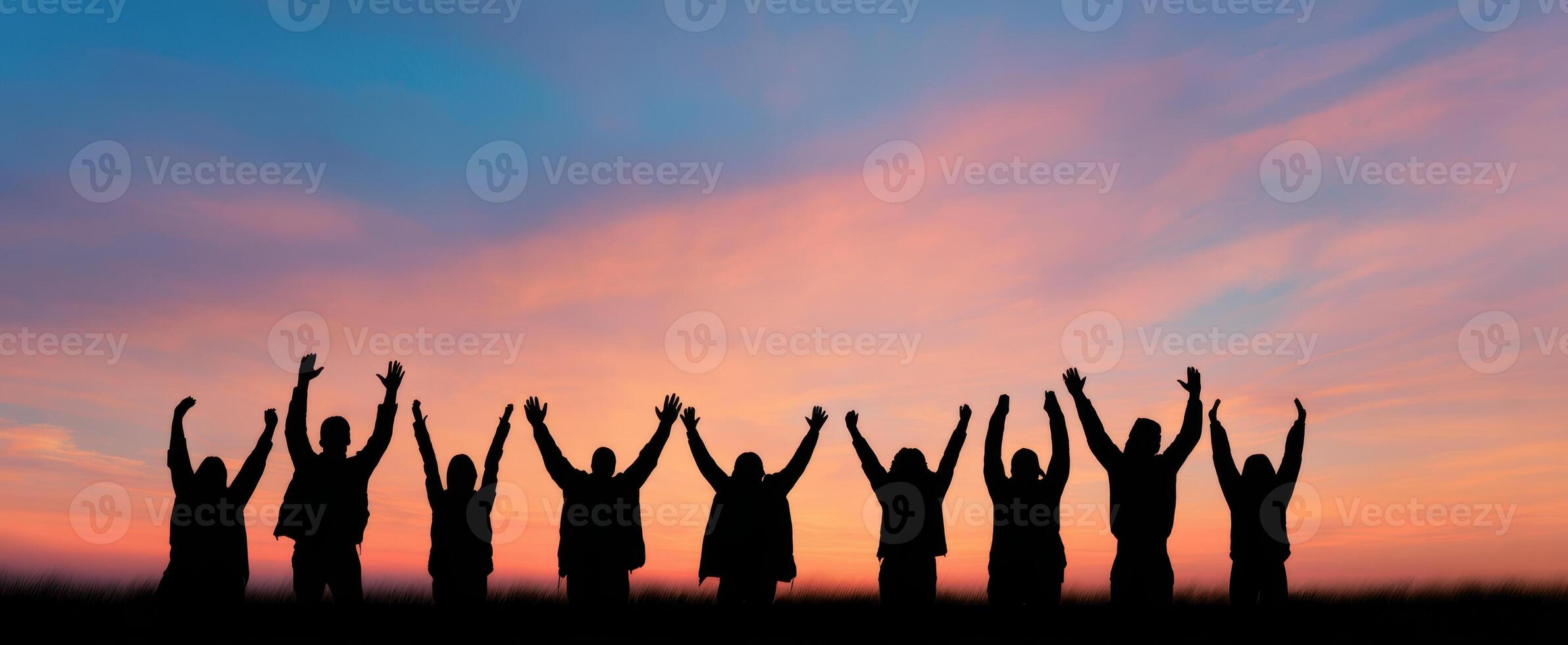 The Joyful Silhouettes Celebrating Together at Sunset photo