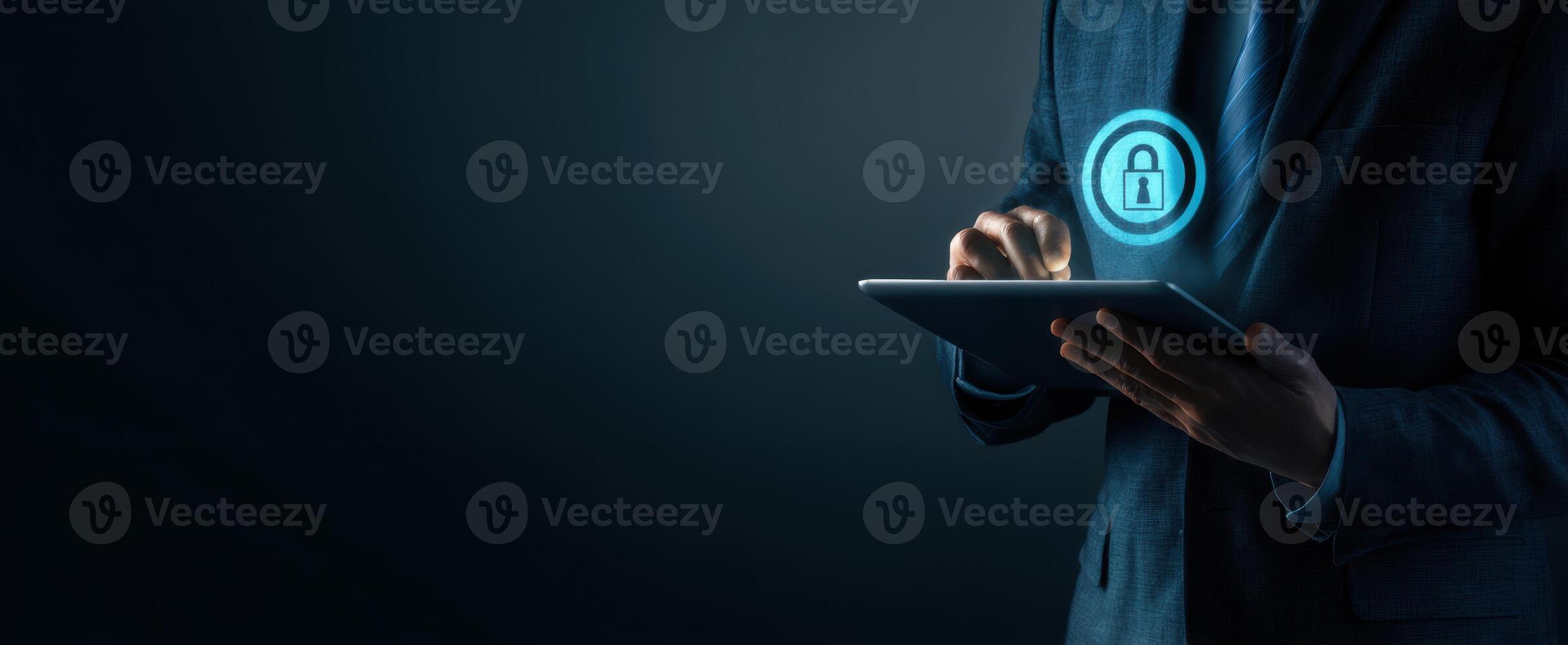 The businessman using a tablet with a security lock icon in a dark background photo