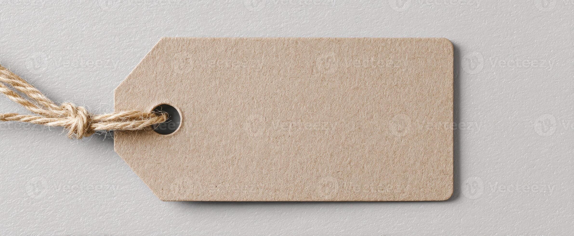 The blank brown tag with rope for crafting and labeling purposes photo