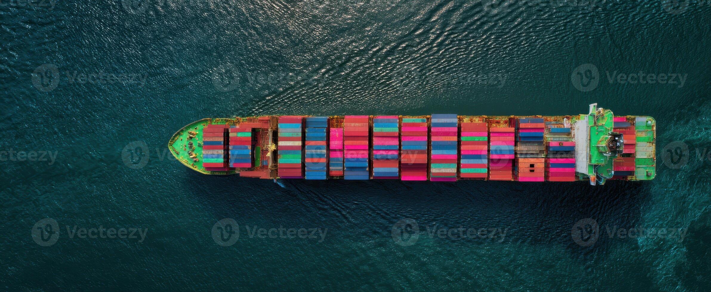 The colorful cargo ship navigating through crystal-clear ocean waters. photo