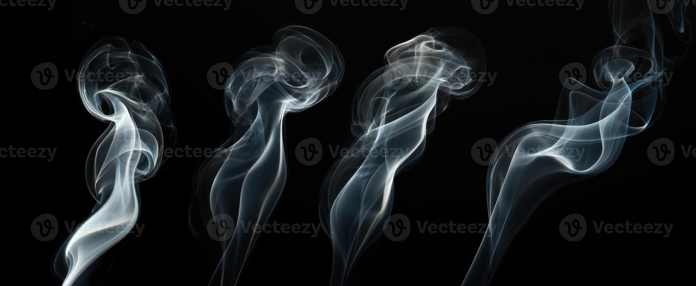 The Elegant Flow of Smoke in Abstract Patterns Against a Black Background photo