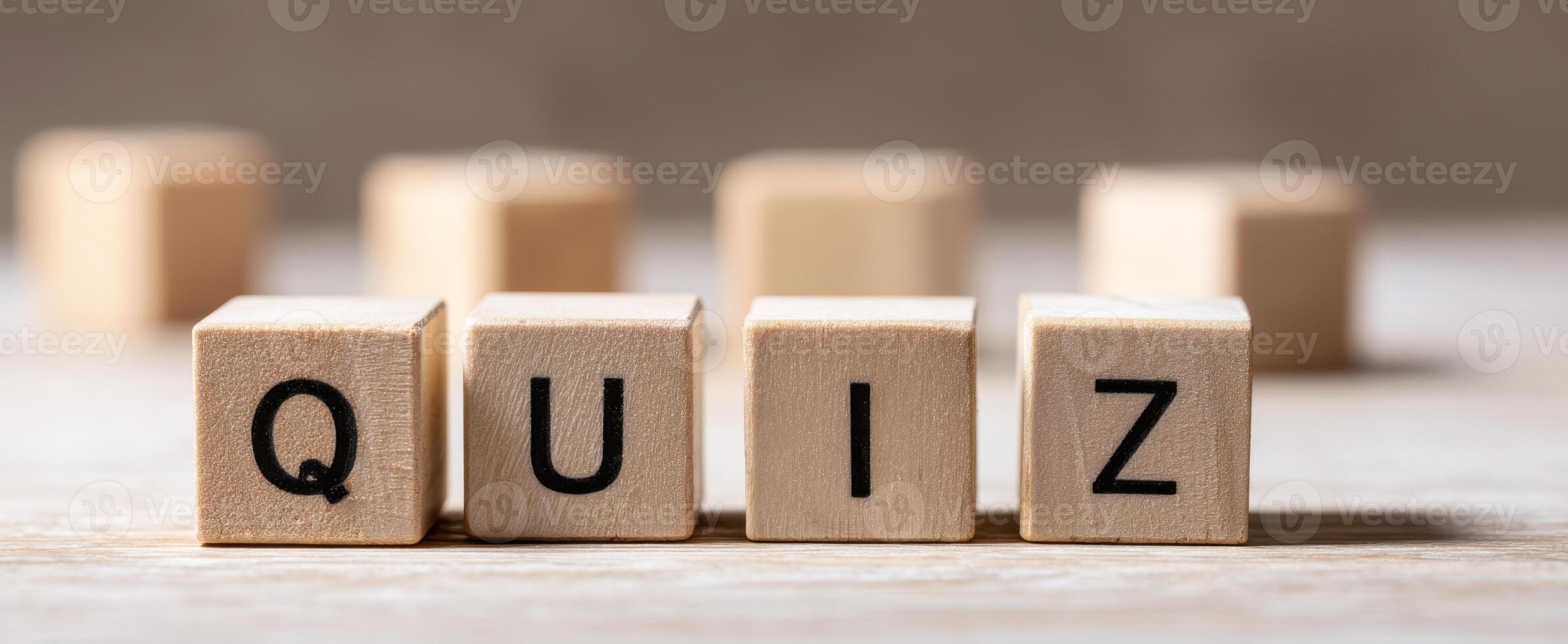 The wooden blocks spelling out the word Quiz on a textured surface. photo