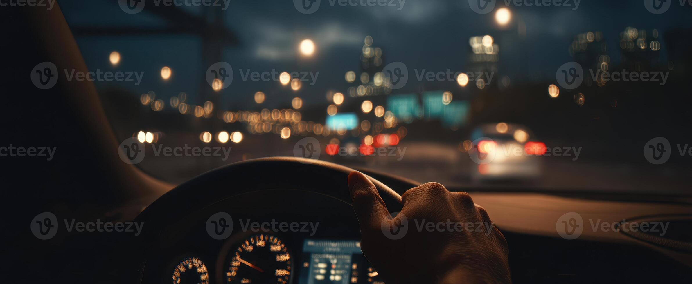 The nighttime drive through a vibrant city illuminated by bright lights. photo