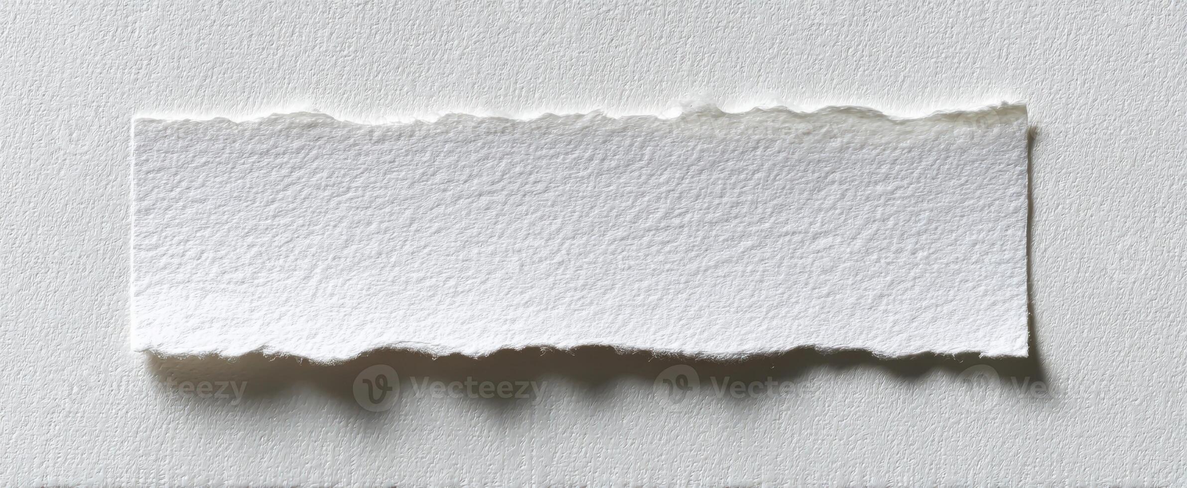 The torn white paper rectangle on a textured background with a minimalist aesthetic photo