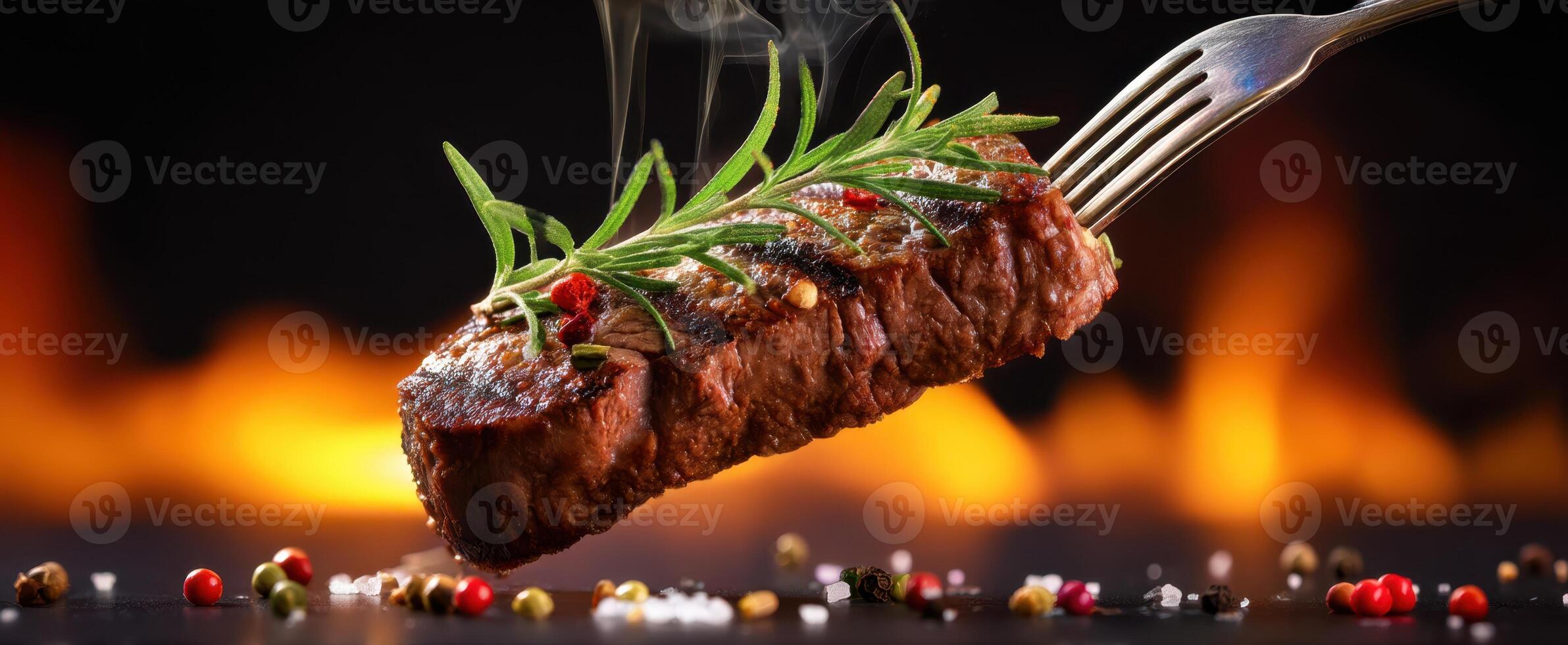 The perfectly grilled steak garnished with herbs and steam rising. photo