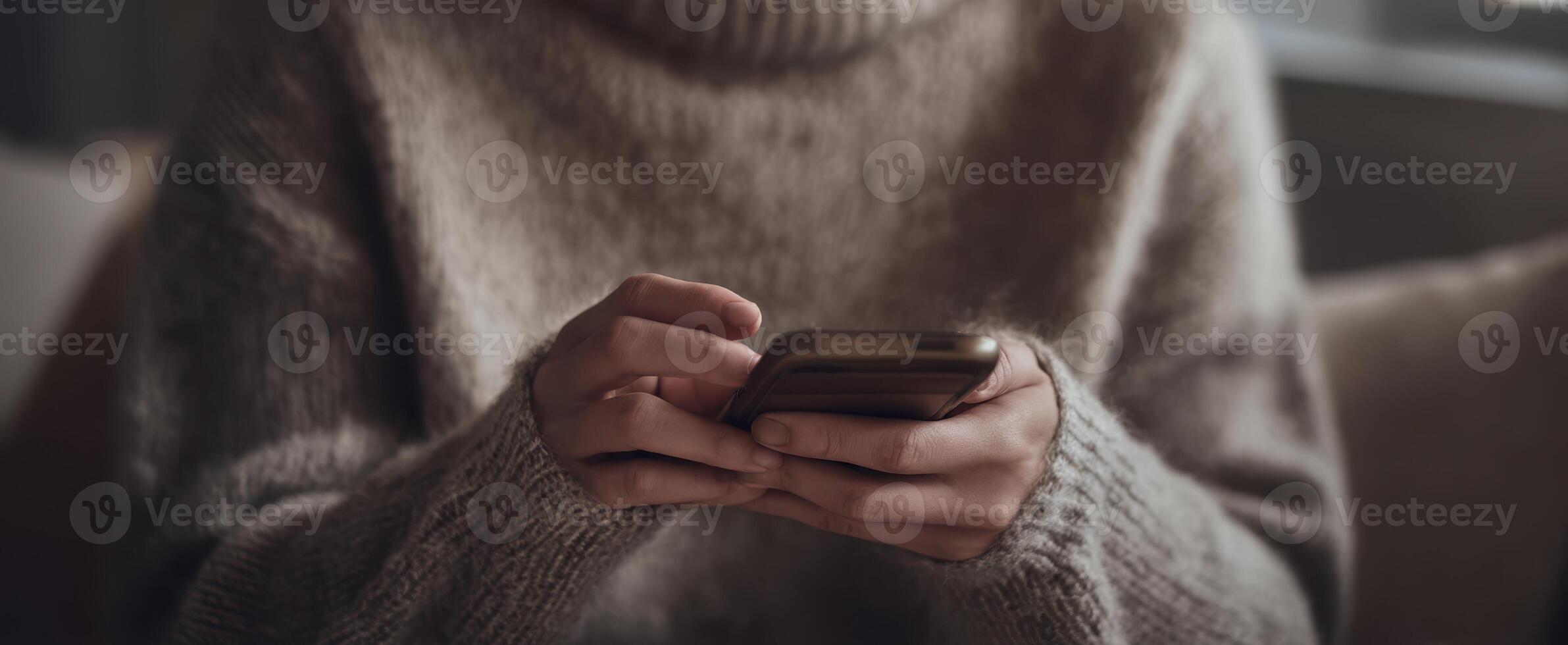 The Hands of a Person Using a Smartphone in a Cozy Setting photo