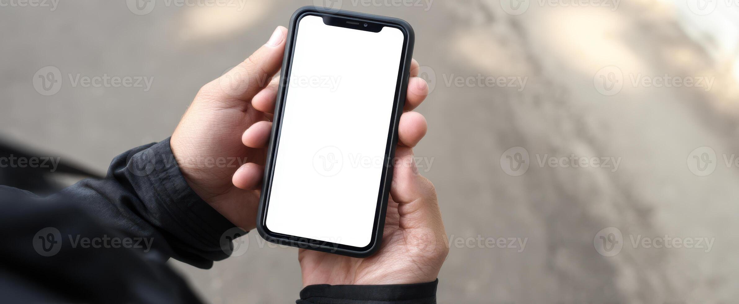 The Smartphone Held in Hand With Blank Screen in Urban Environment photo