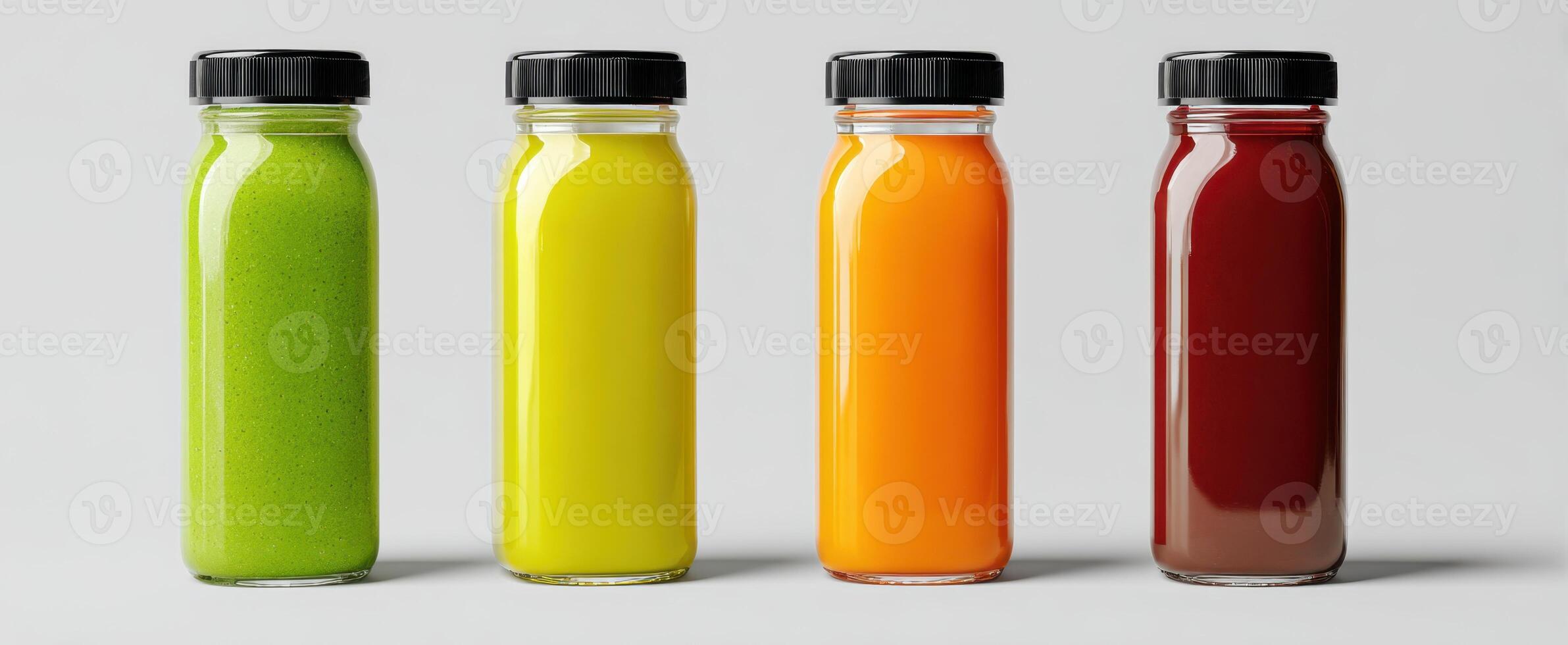 The vibrant selection of colorful juices in glass bottles. photo