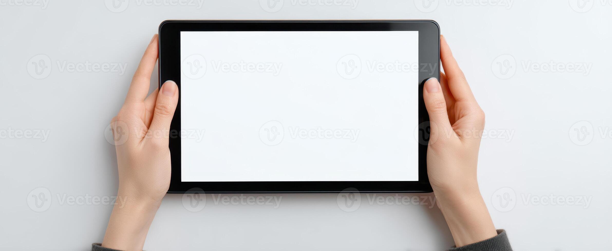 The tablet displayed in hands ready for digital content creation. photo