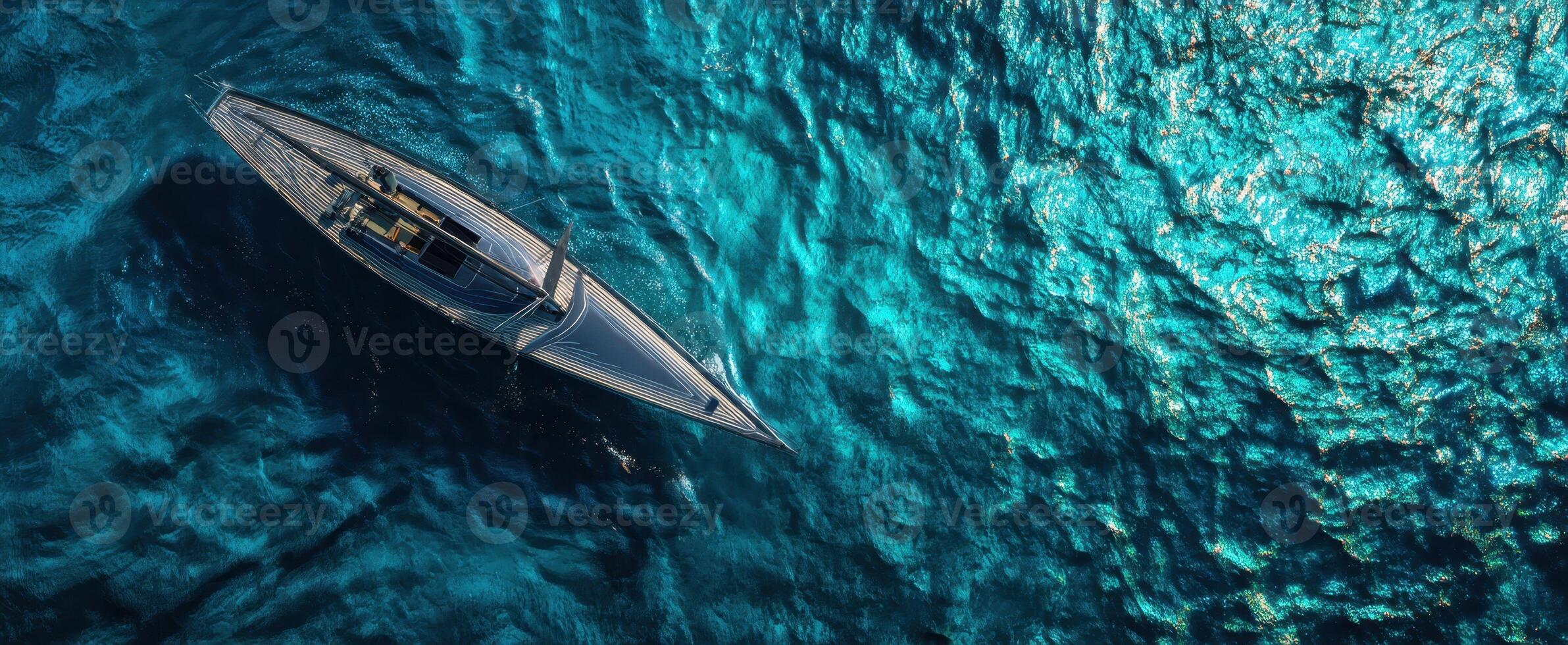 The elegant yacht sailing through crystal-clear turquoise waters on a sunny day. photo