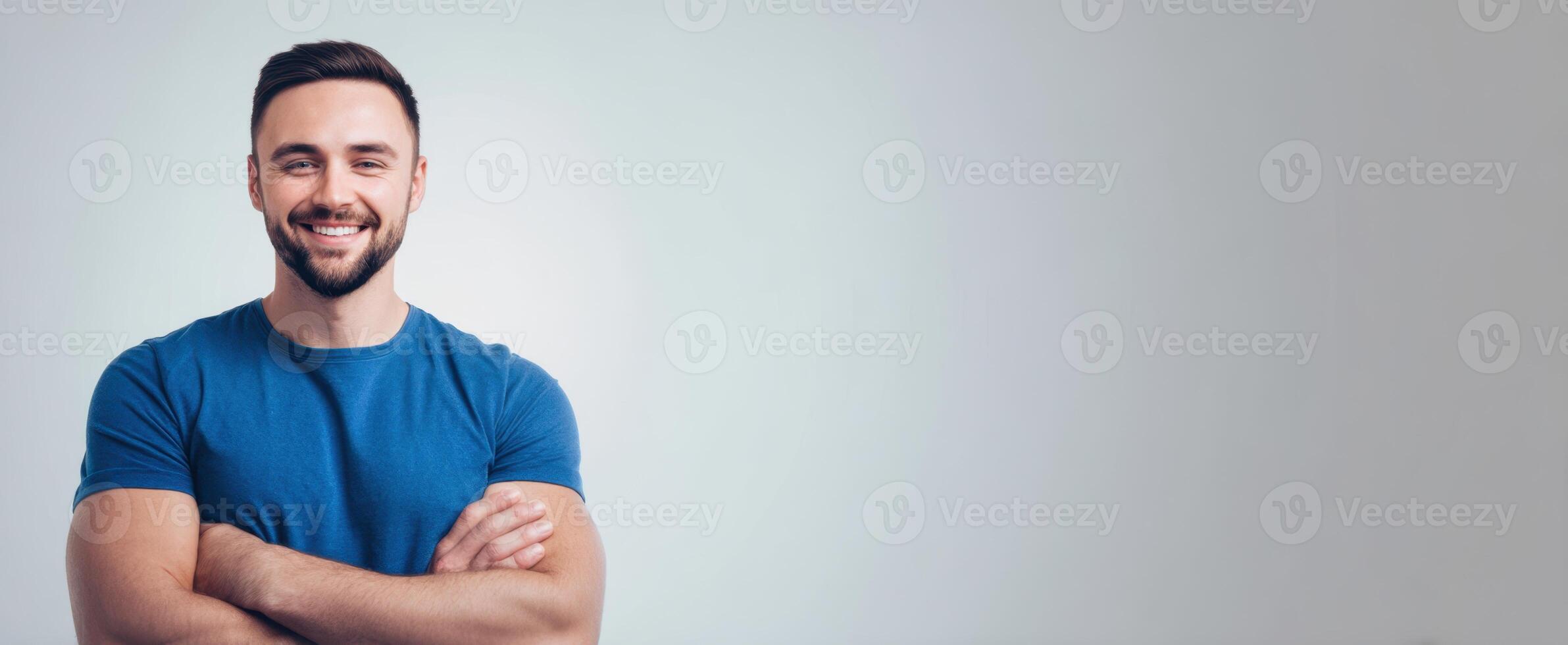 The Confident Man Smiling with Arms Crossed in a Casual Portrait photo