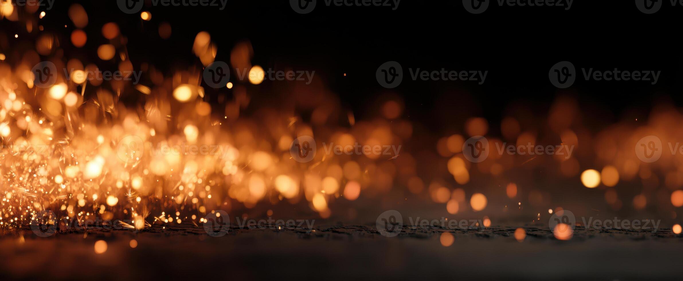 The mesmerizing dance of glowing sparks illuminating the dark background. photo