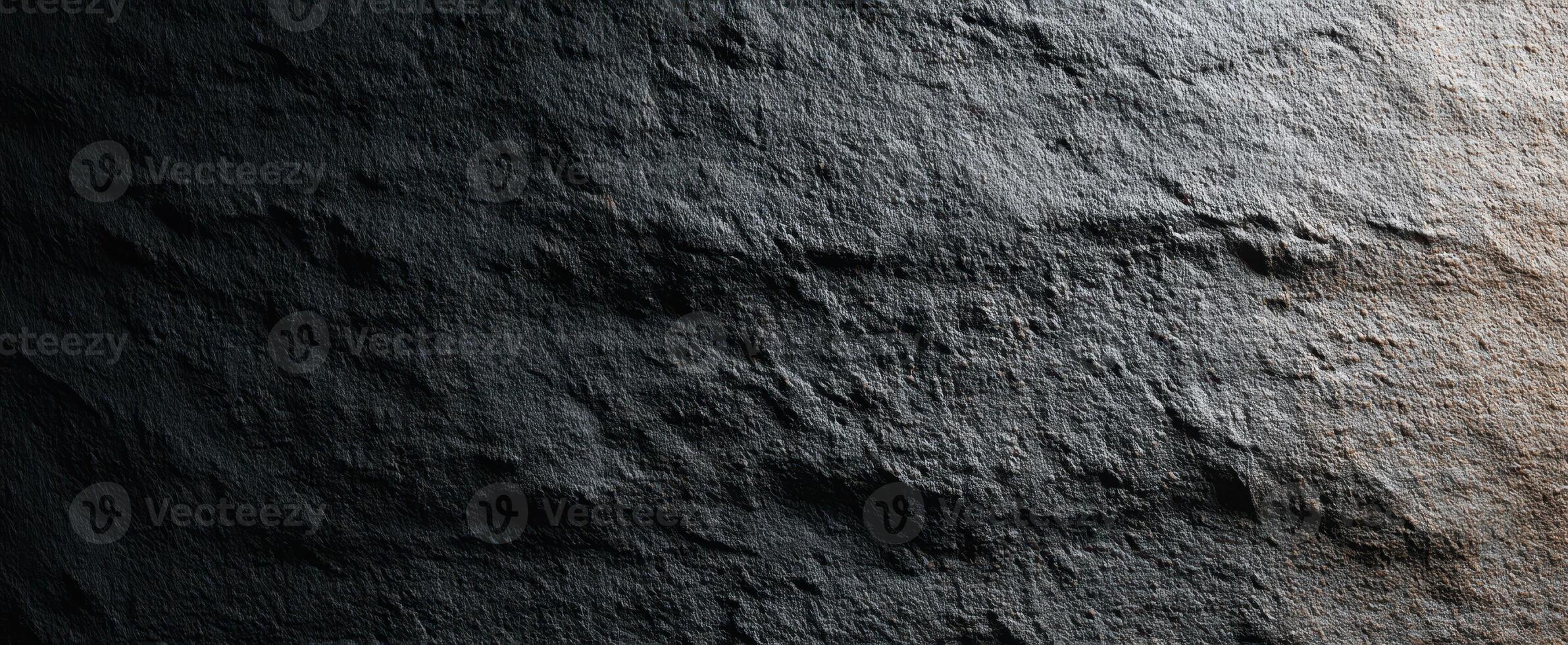 The Dark Textured Surface of a Naturally Weathered Stone. photo