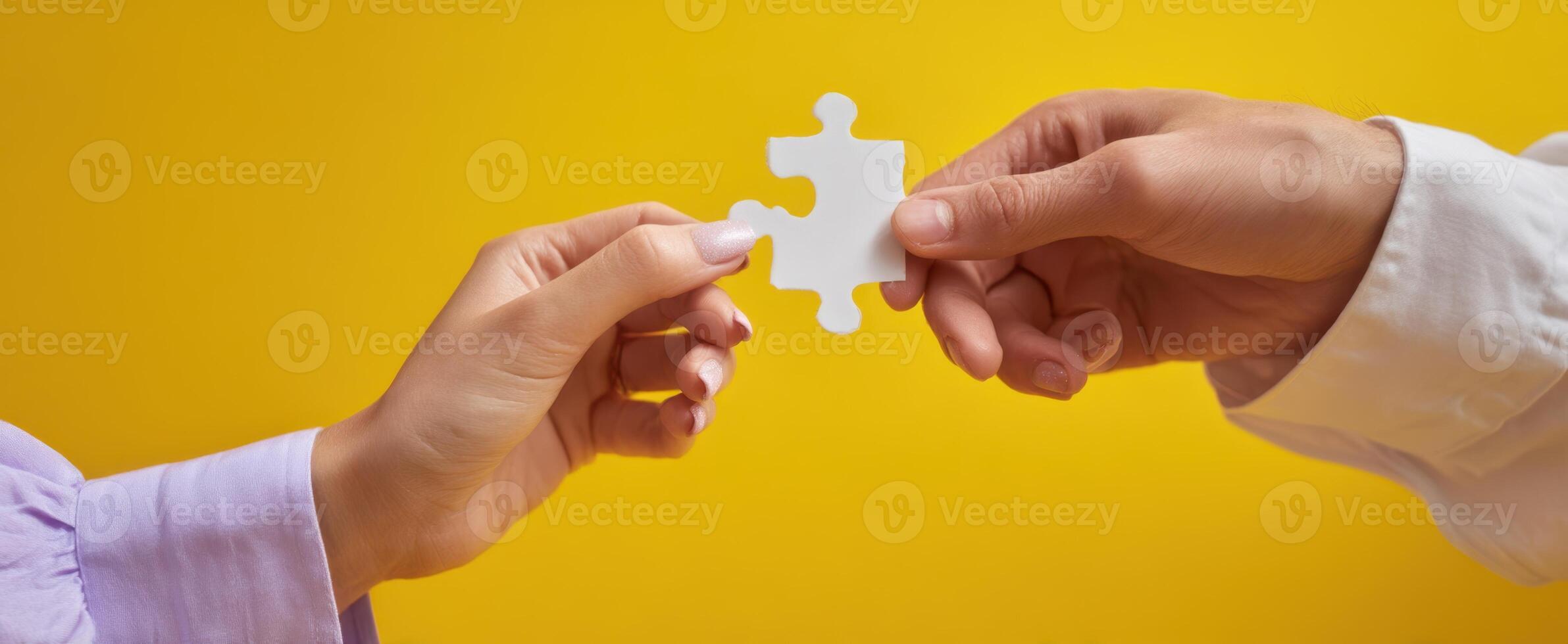 The Hands Joining Together to Complete a Puzzle Piece photo