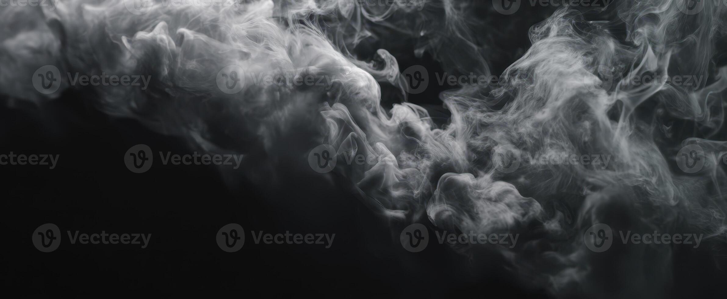 The mesmerizing swirl of smoke against a dark background, creating a mystic atmosphere. photo