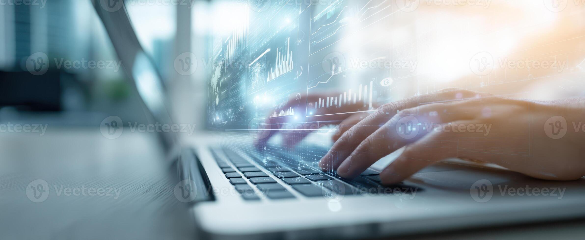 The Hands Typing on a Laptop with Digital Data Visualization Concepts photo