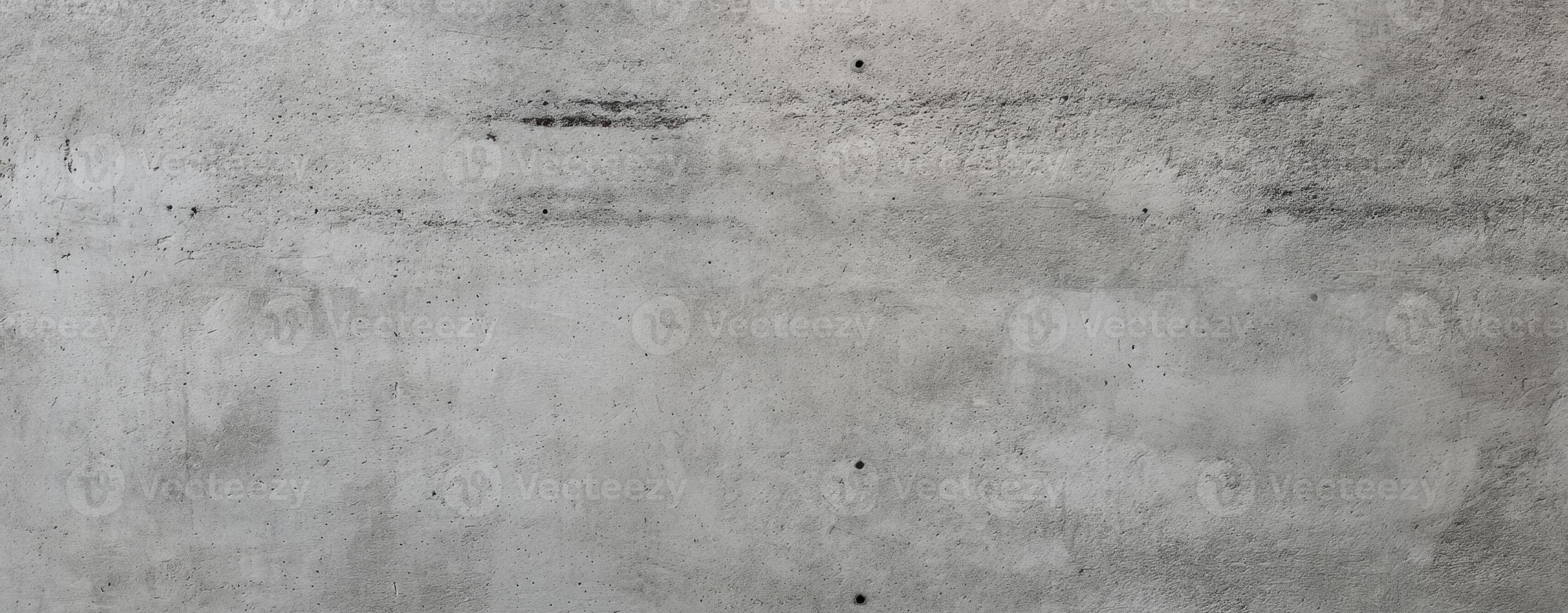 The textured surface of a concrete wall showcasing industrial elegance and simplicity. photo