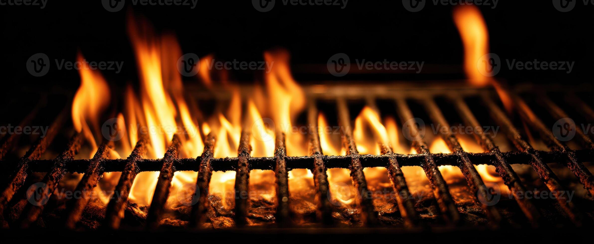 The vibrant flames dancing on a modern barbecue grill. photo