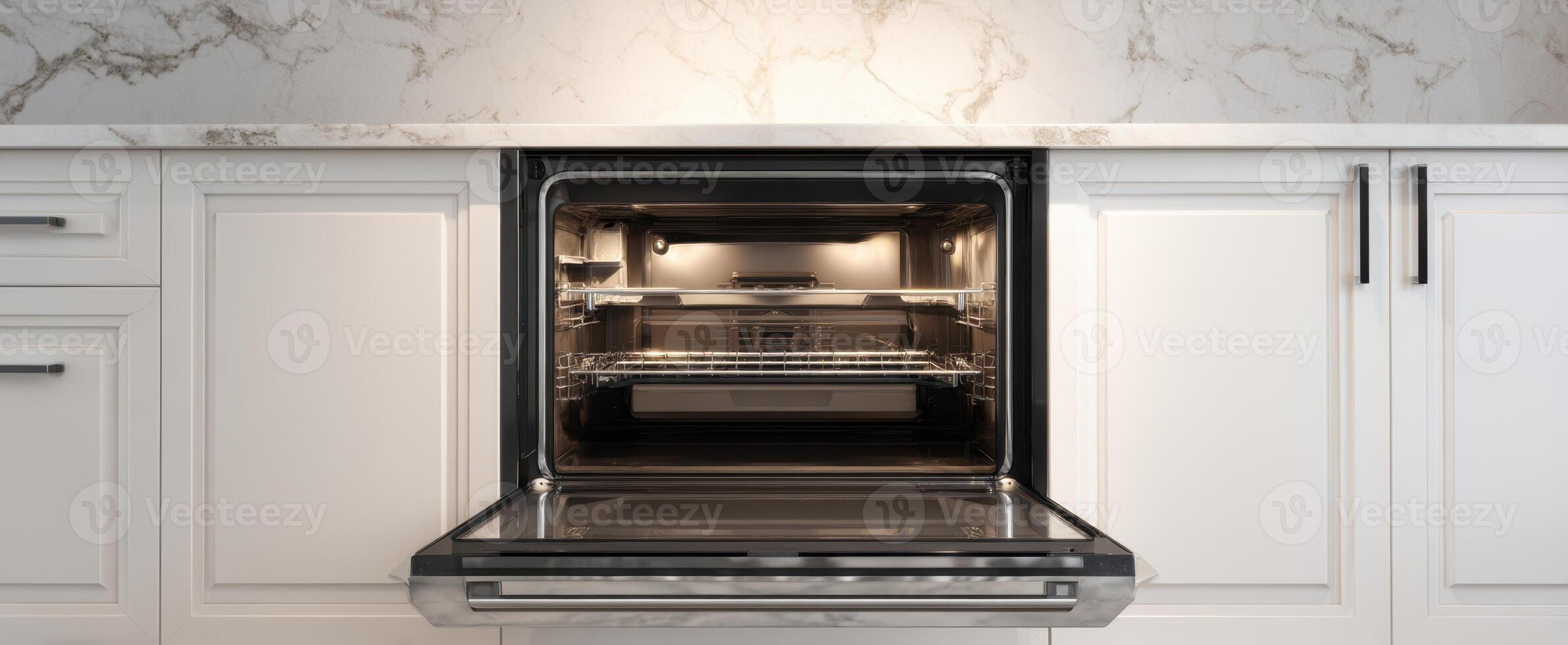 The modern kitchen oven with a sleek design and elegant marble countertop. photo