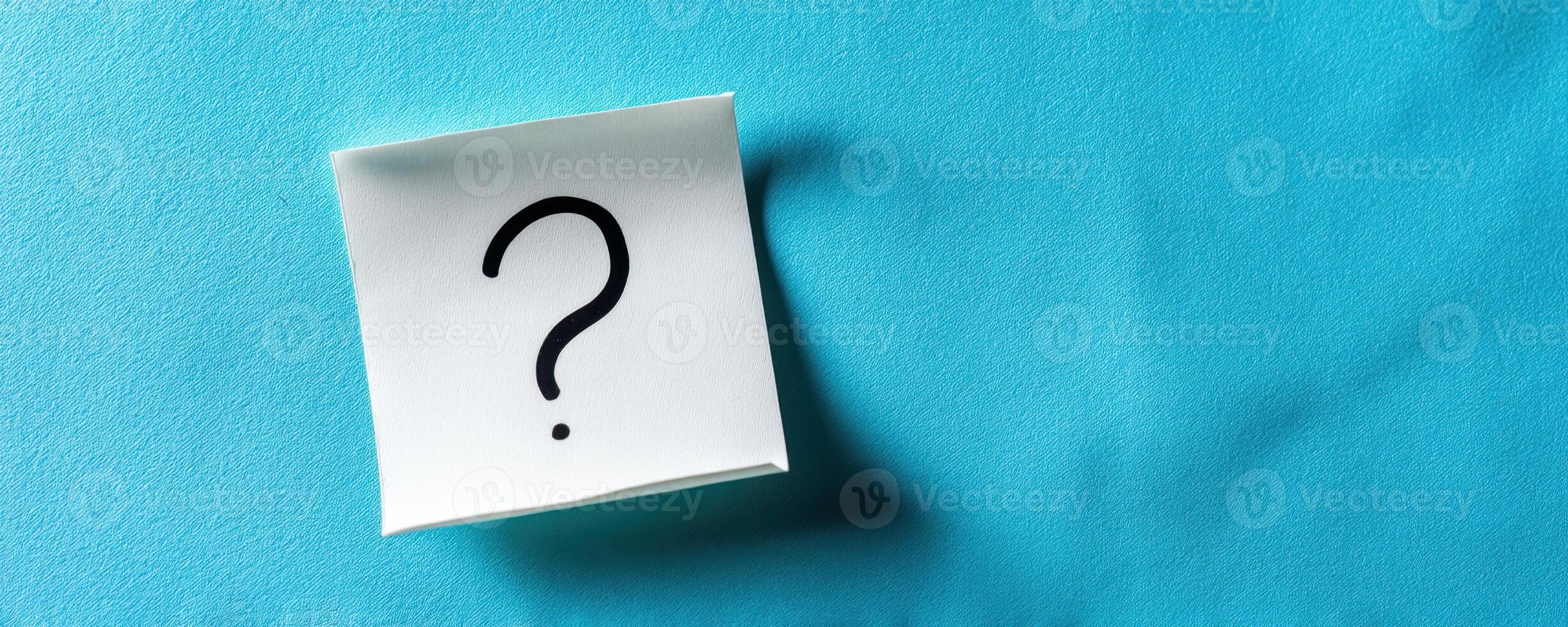 The question mark on a note symbolizing curiosity and inquiry. photo