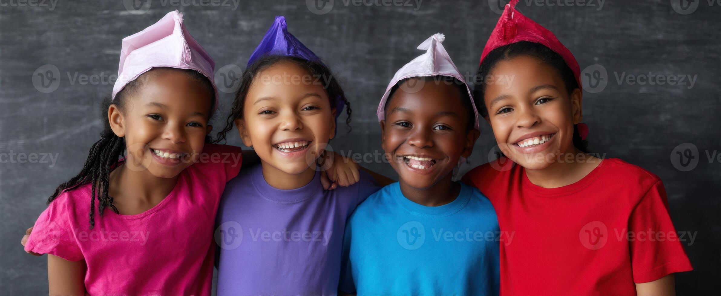 The joyful group of children celebrating together with colorful hats and smiles. photo