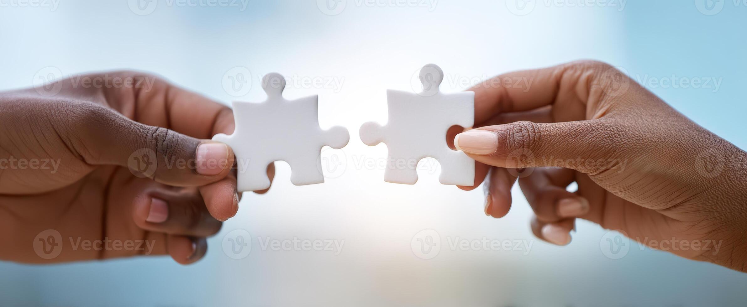 The Hands Connecting Two Puzzle Pieces in Symbolic Collaboration photo