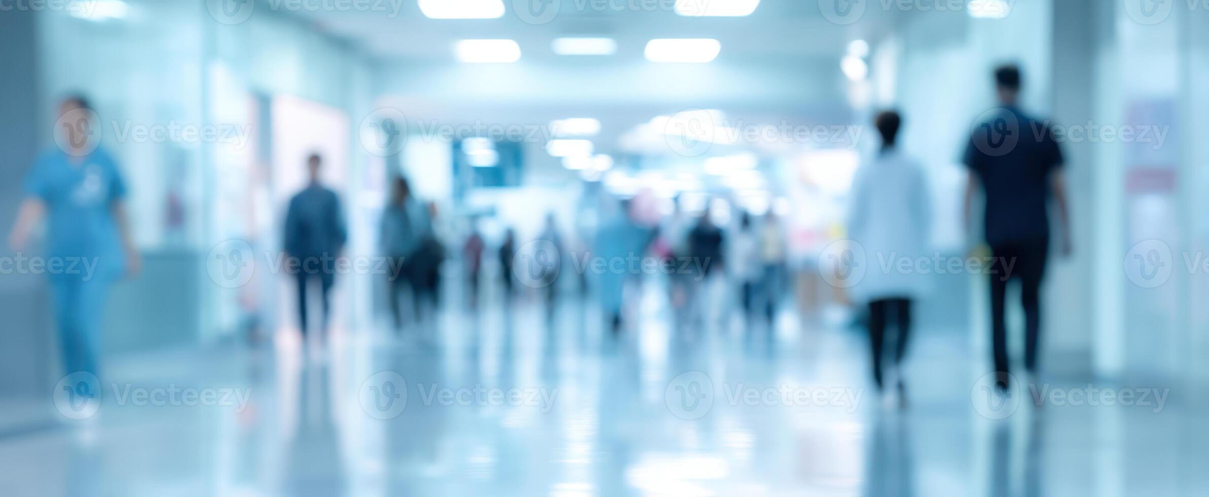 The bustling hospital corridor filled with healthcare professionals and patients. photo