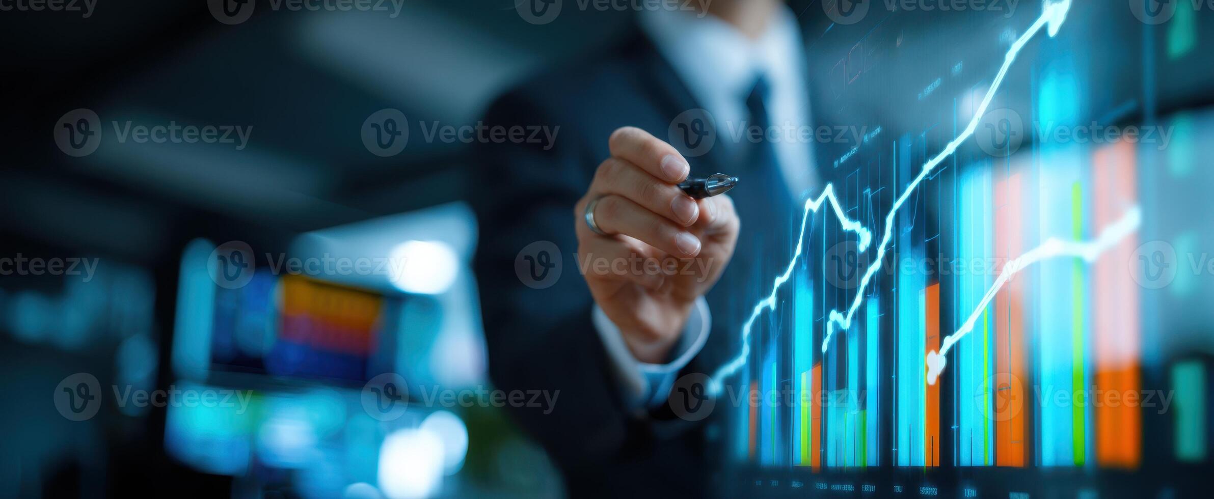The businessman analyzing financial growth through interactive digital graphs and charts. photo