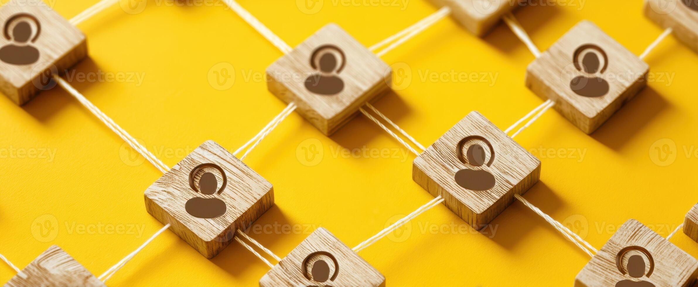 The Networking Connection with Wooden Figures on a Vibrant Yellow Background photo