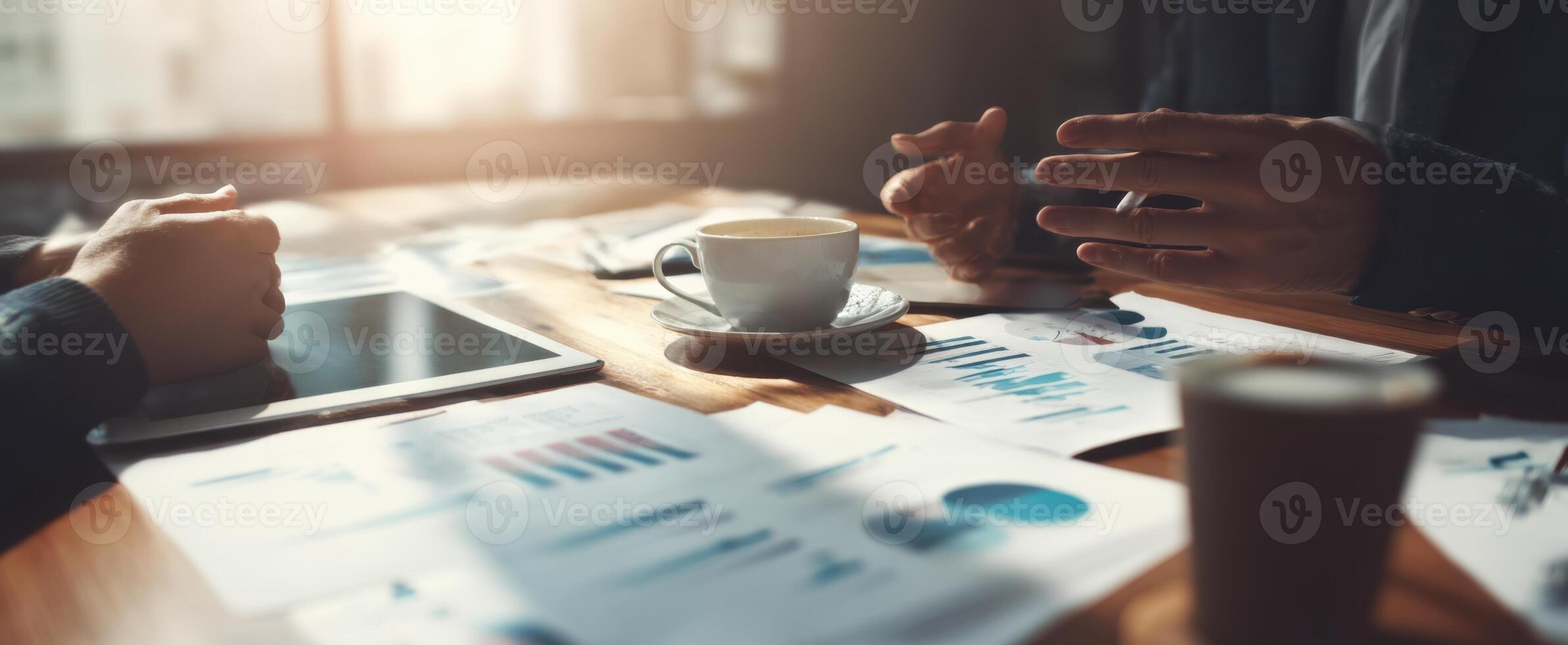 The business meeting featuring charts, coffee, and collaboration in a stylish workspace. photo