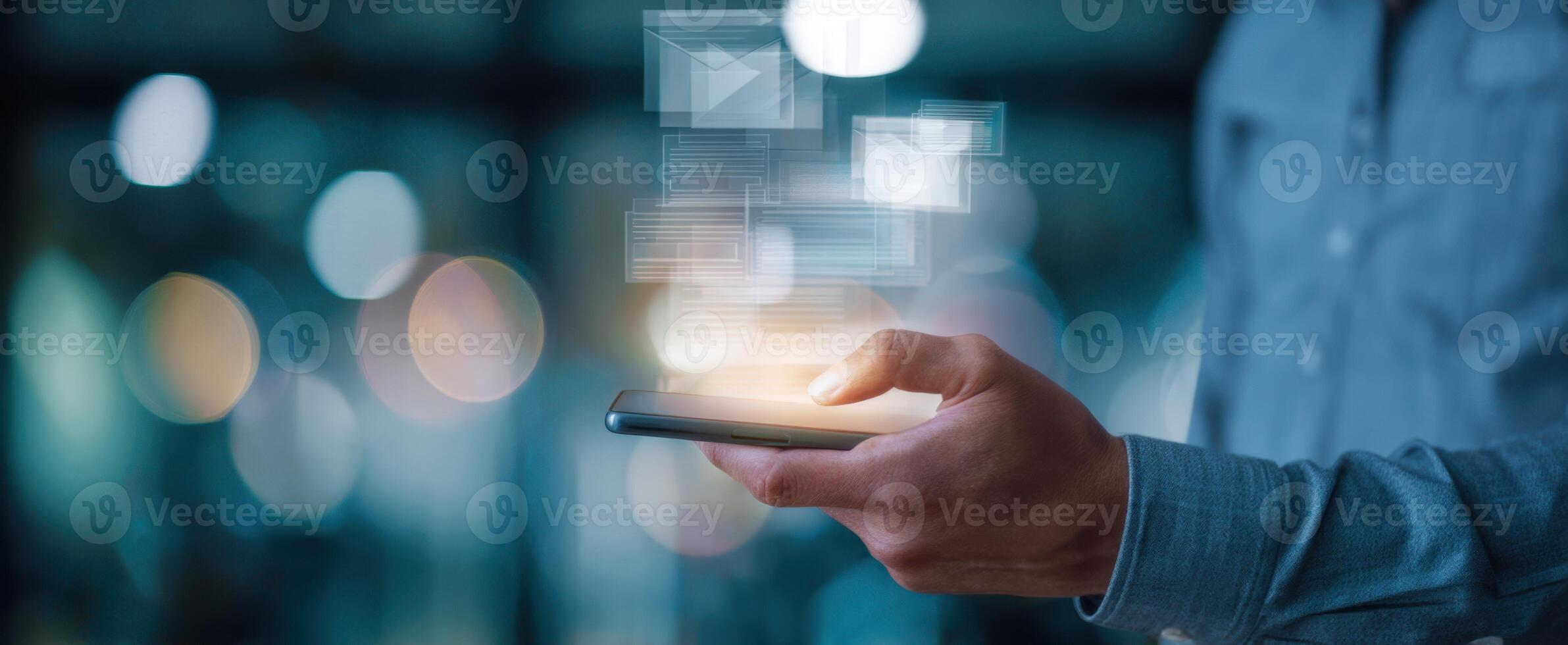 The smartphone displaying floating email notifications in a modern setting. photo
