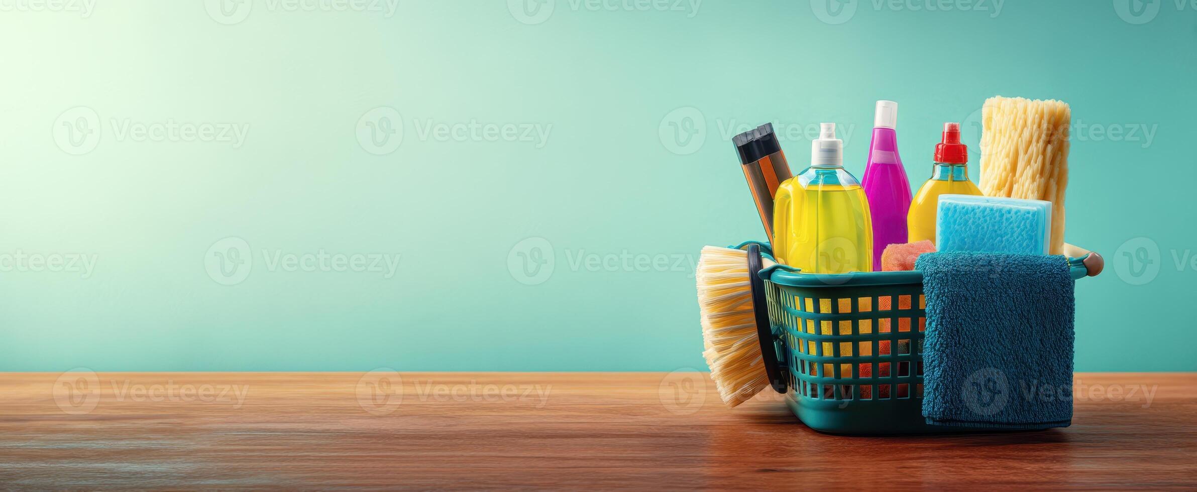 The collection of vibrant cleaning supplies in a stylish basket on a wooden surface. photo