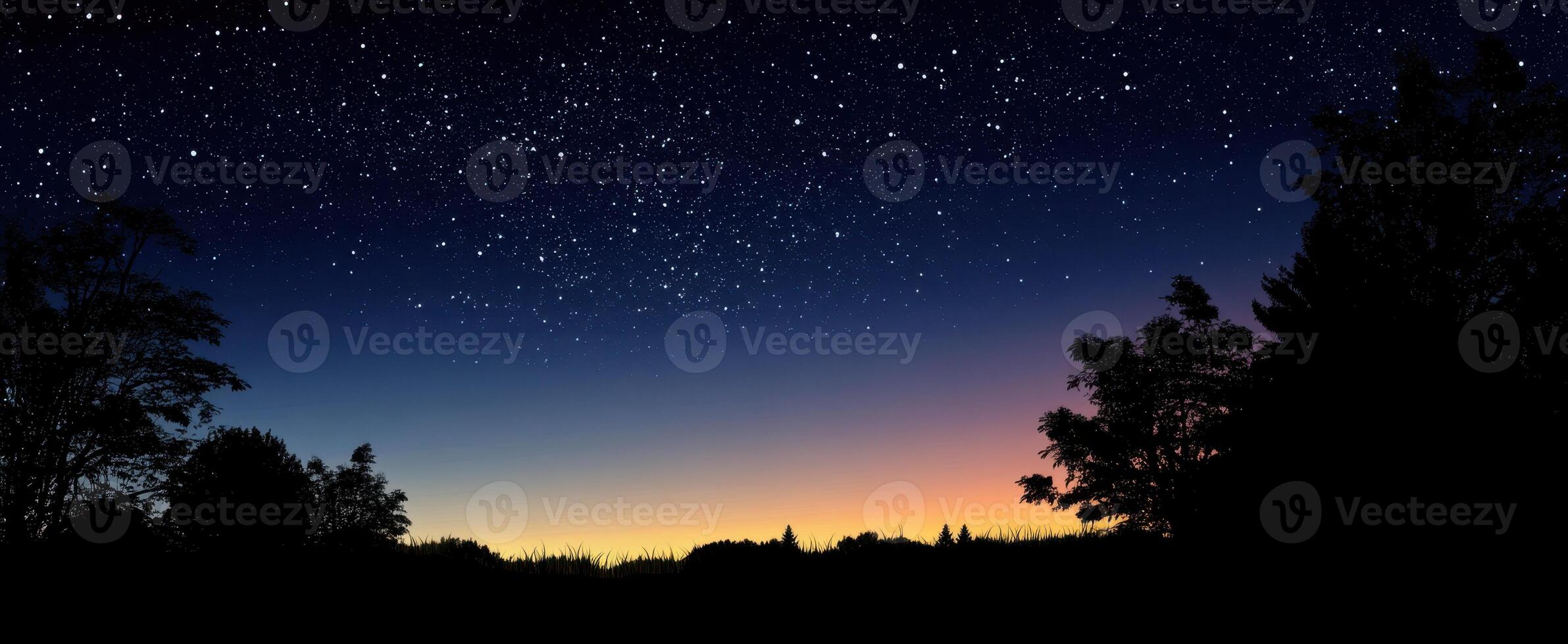 The stunning starry night sky over a tranquil rural landscape at dusk. photo
