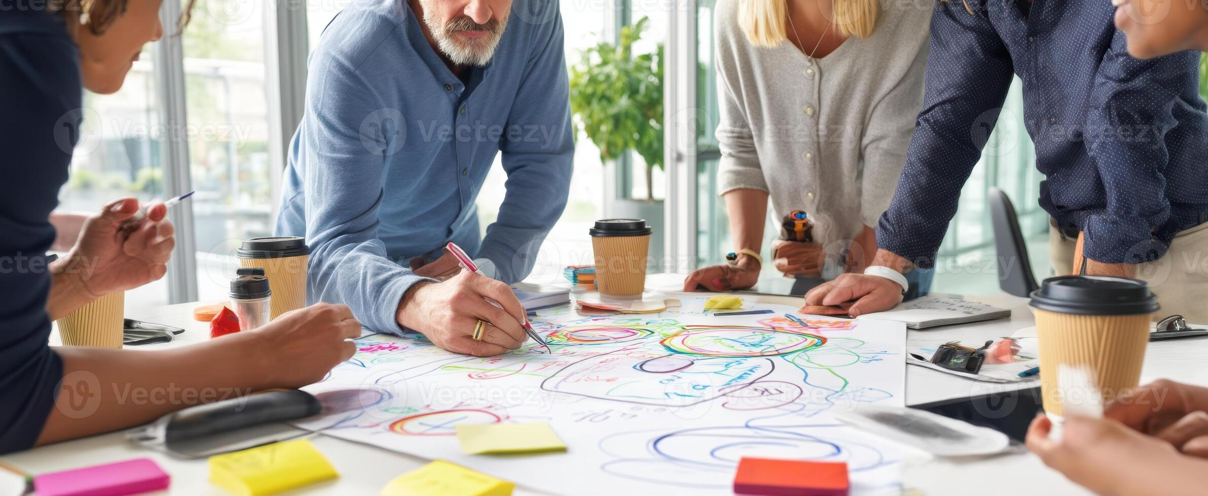The group engaged in creative brainstorming session at a modern workspace. photo