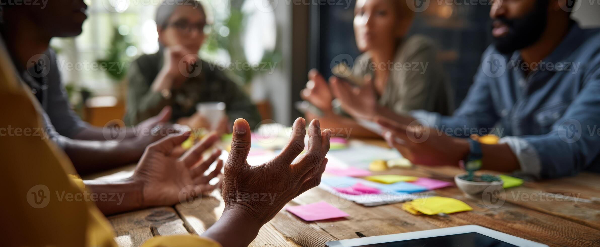 The engaged team collaborating over ideas at a modern workspace table. photo