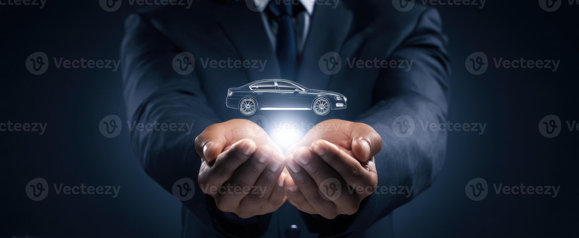 The businessman presenting a futuristic car concept in his hands. photo