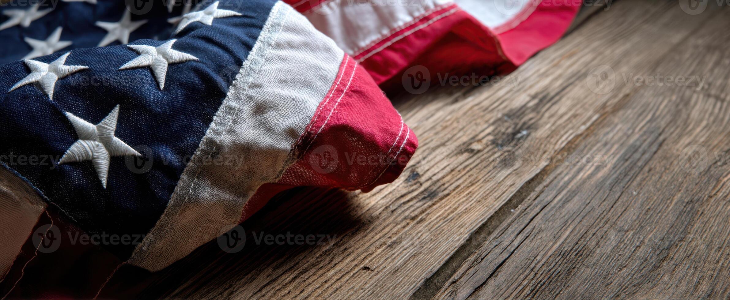 The American flag elegantly draped on rustic wooden background showcasing textures. photo