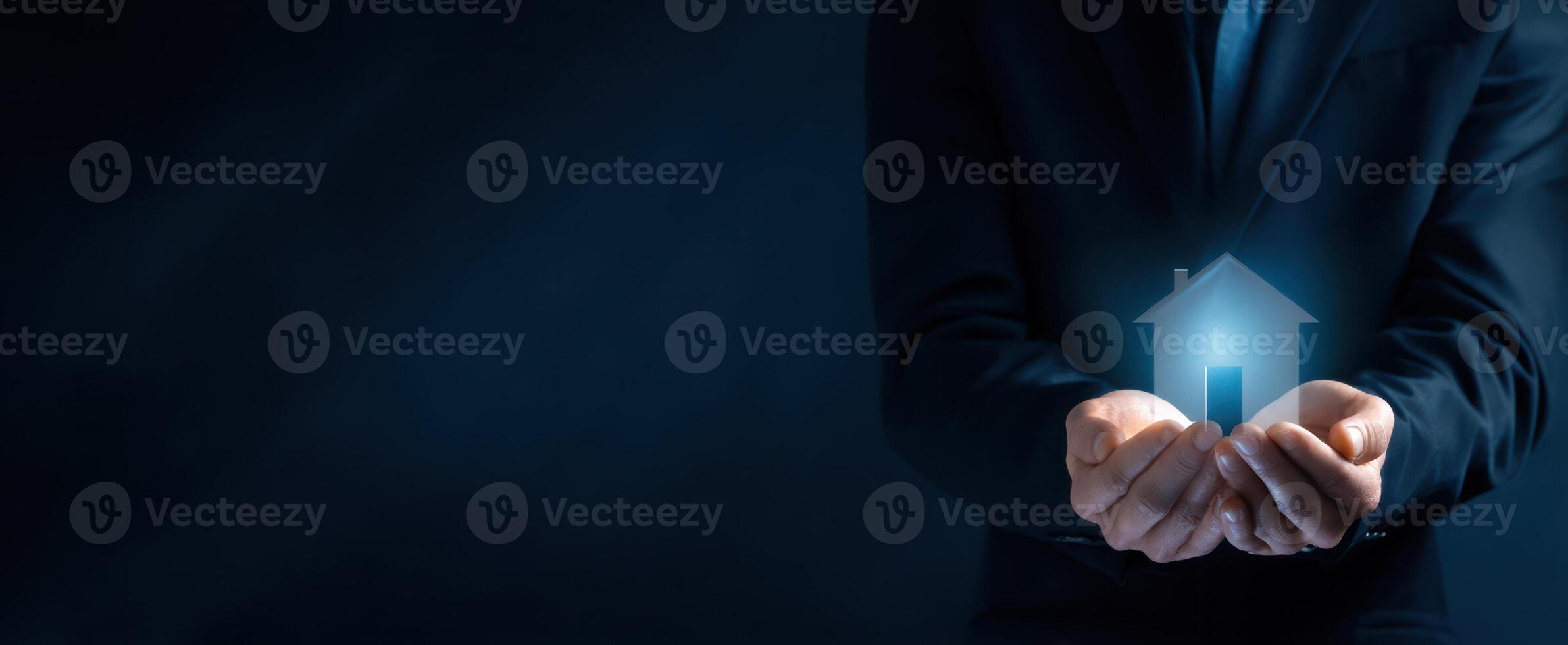 The Hands Holding a Digital House Icon Symbolizing Future Home Ownership photo
