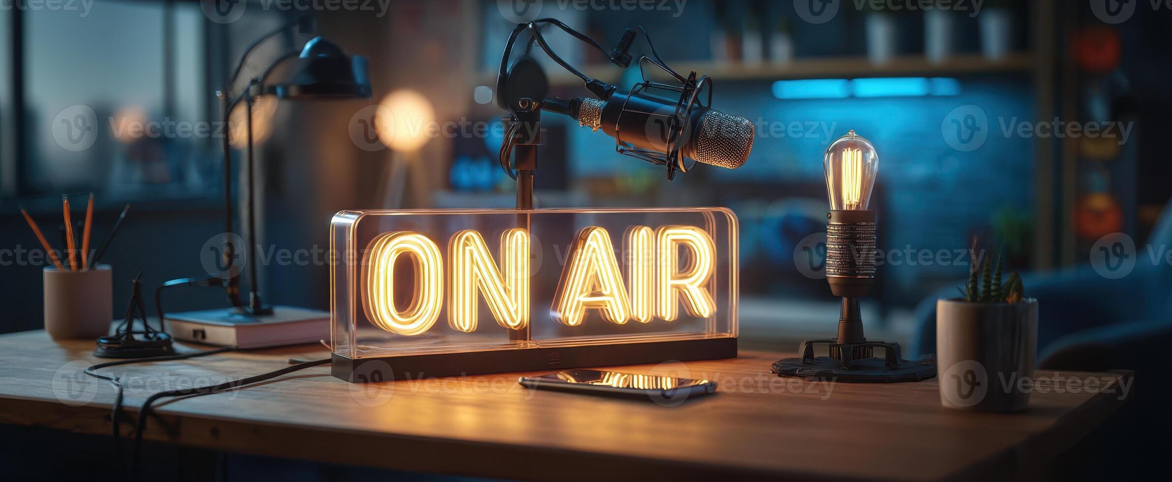 The illuminated ON AIR sign in a contemporary broadcasting studio workspace. photo