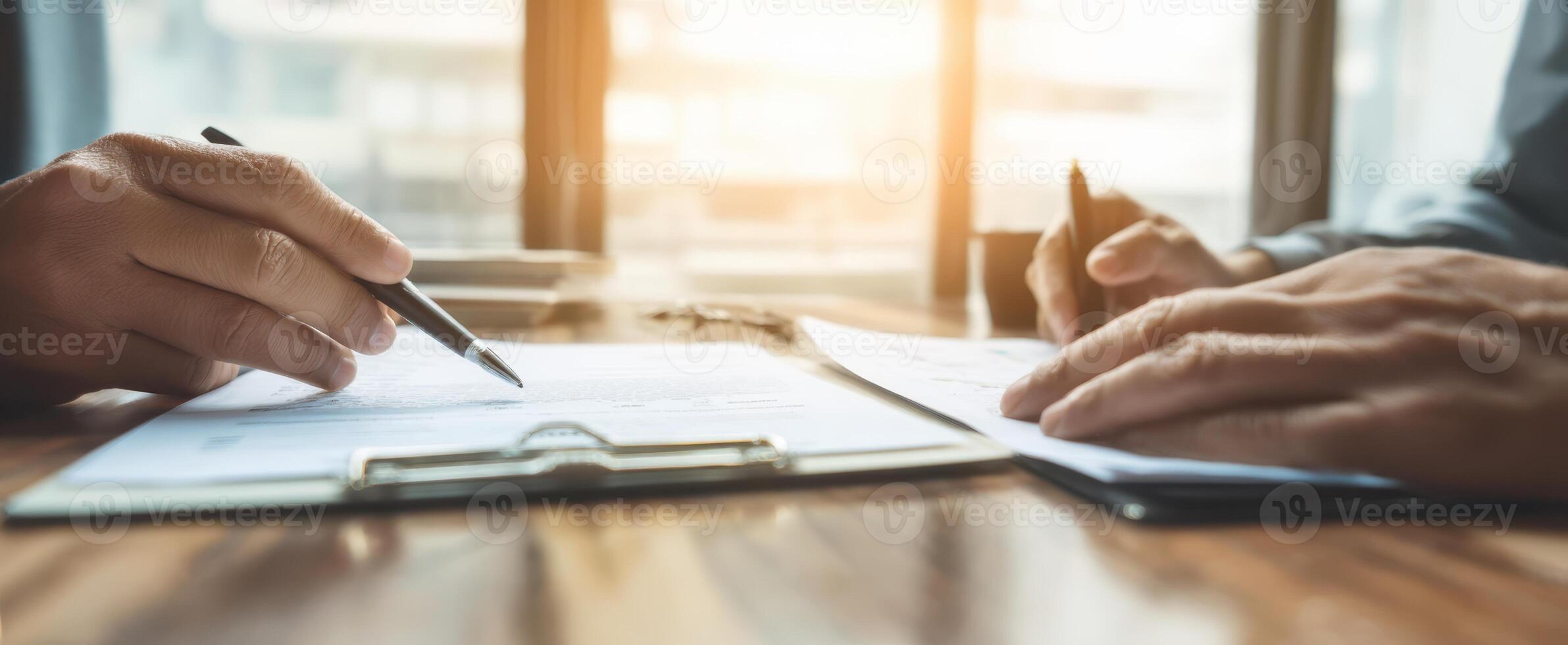 The Hands Collaborating Over Important Business Documents in an Office Setting photo
