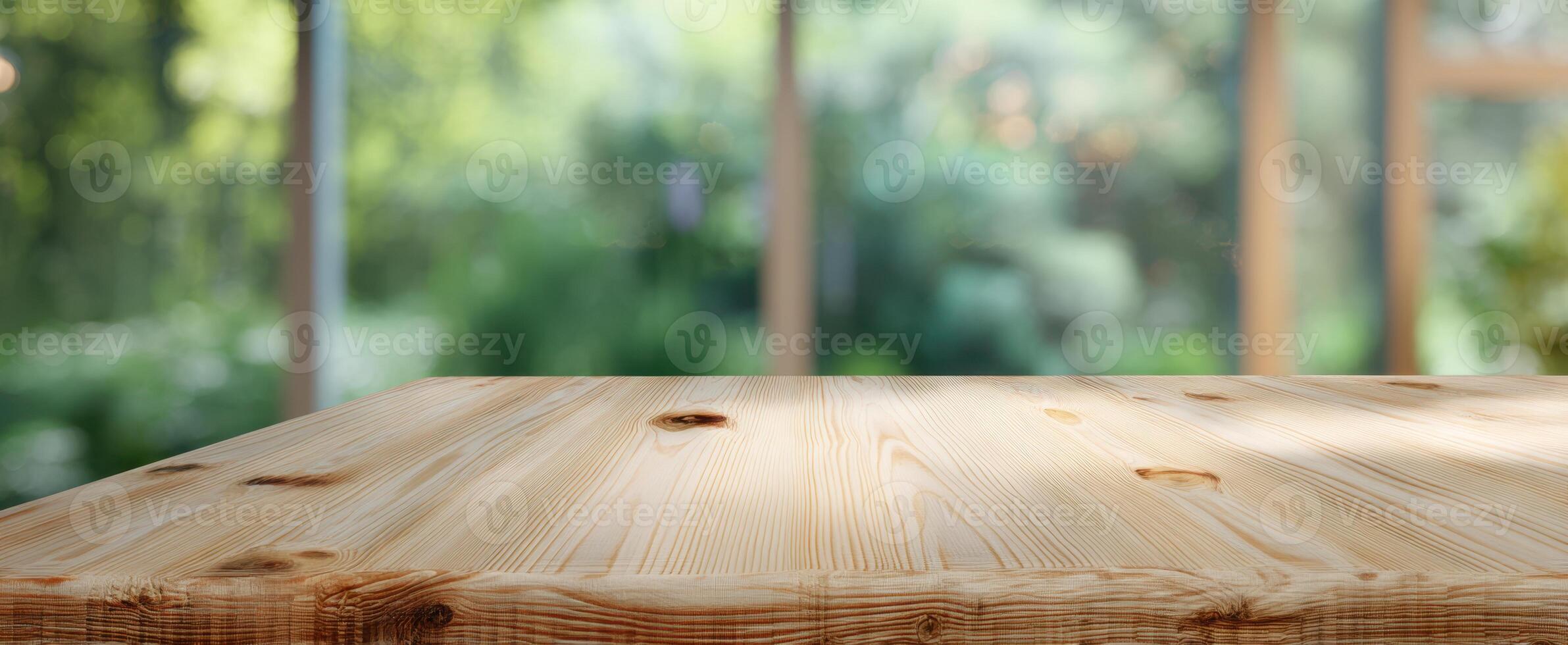 The wooden table offers a serene view of a natural green background. photo