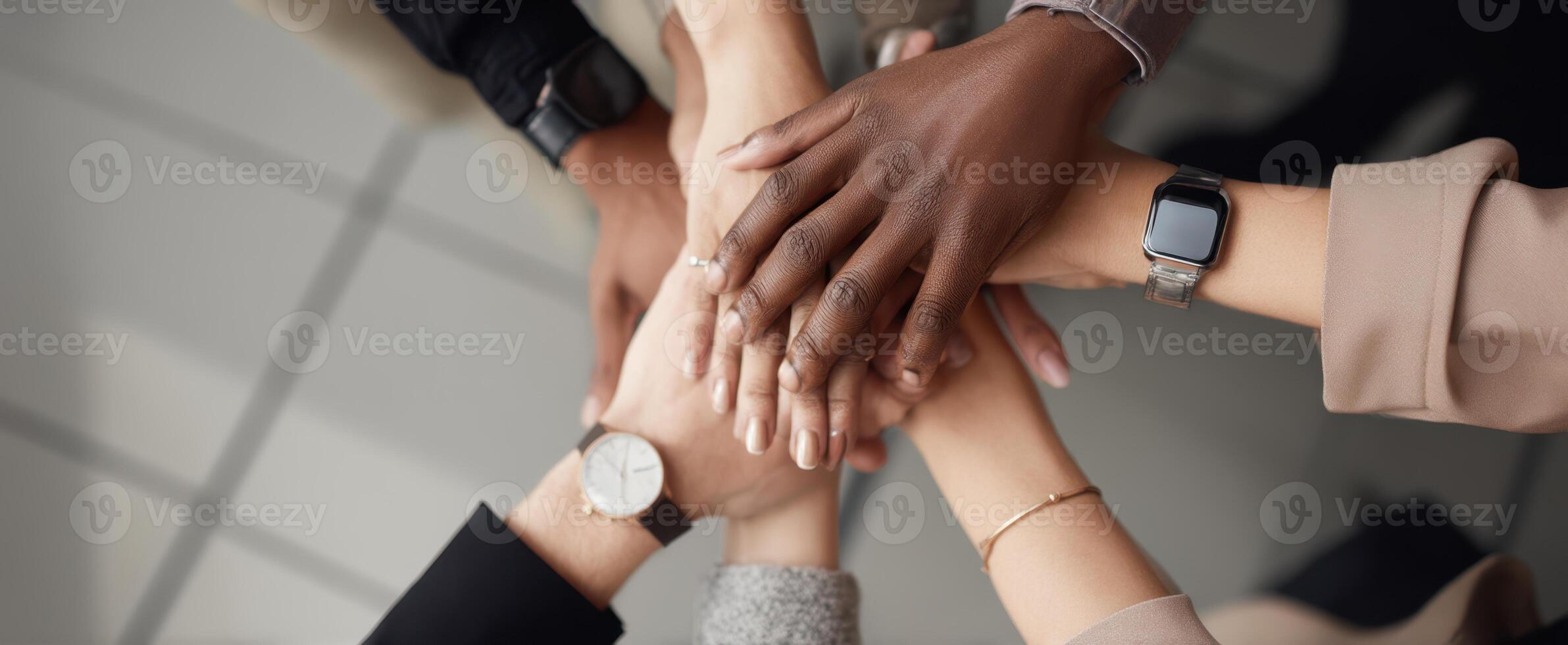 The collaborative hands representing unity and teamwork in a professional setting. photo