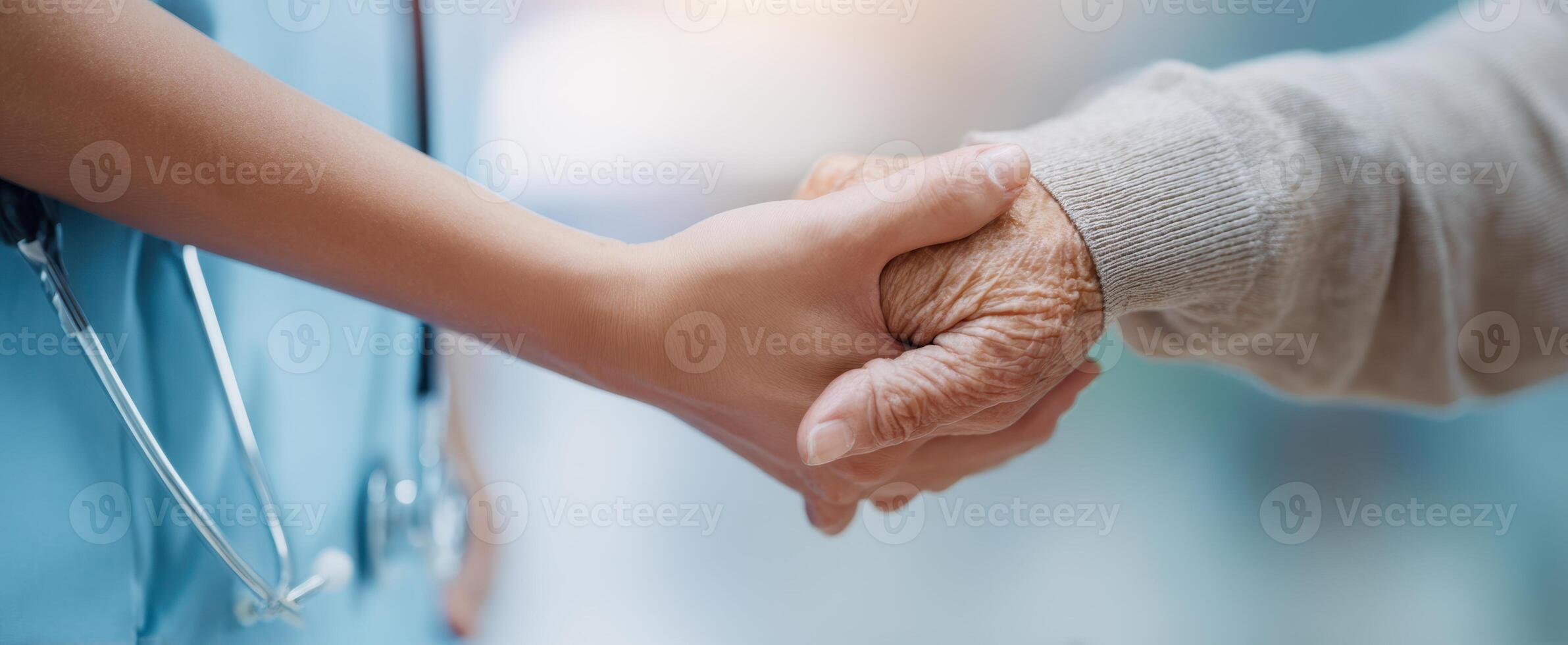 The compassionate connection between a caregiver and an elderly patient. photo