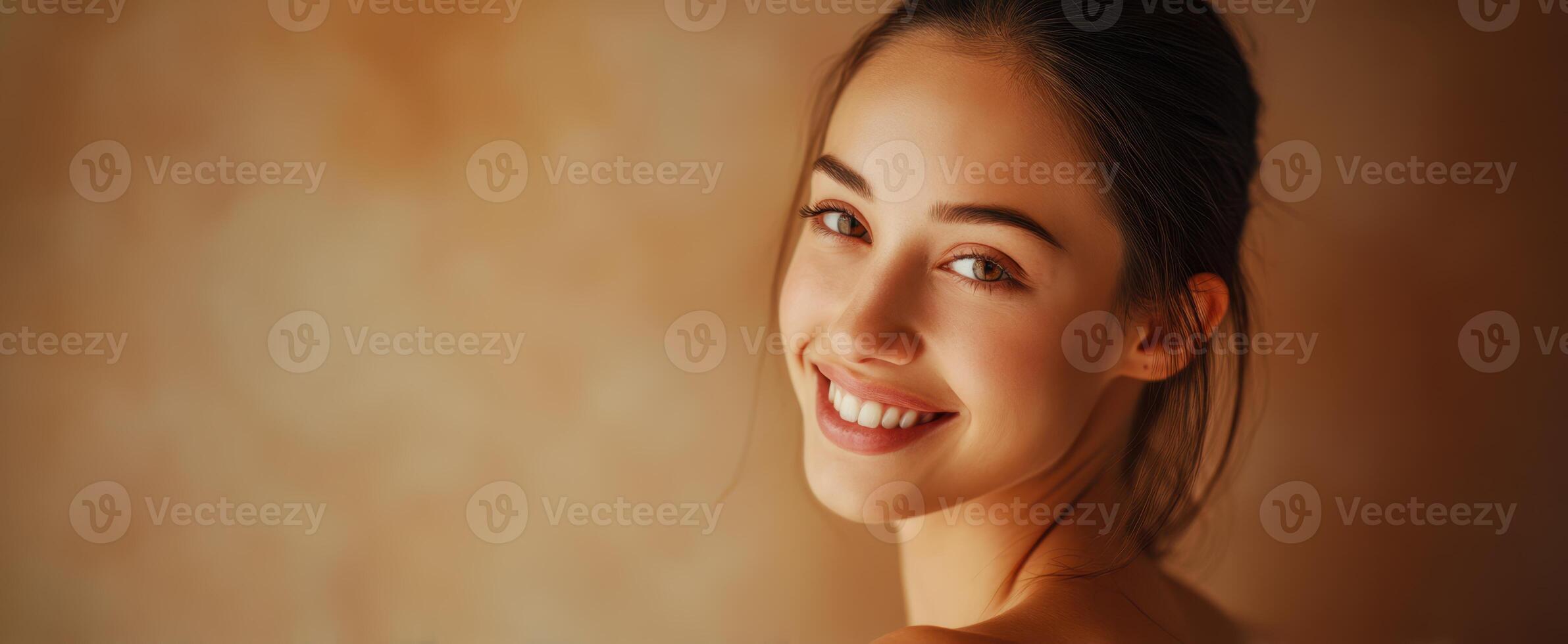 The captivating woman radiating joy and warmth in a serene portrait. photo
