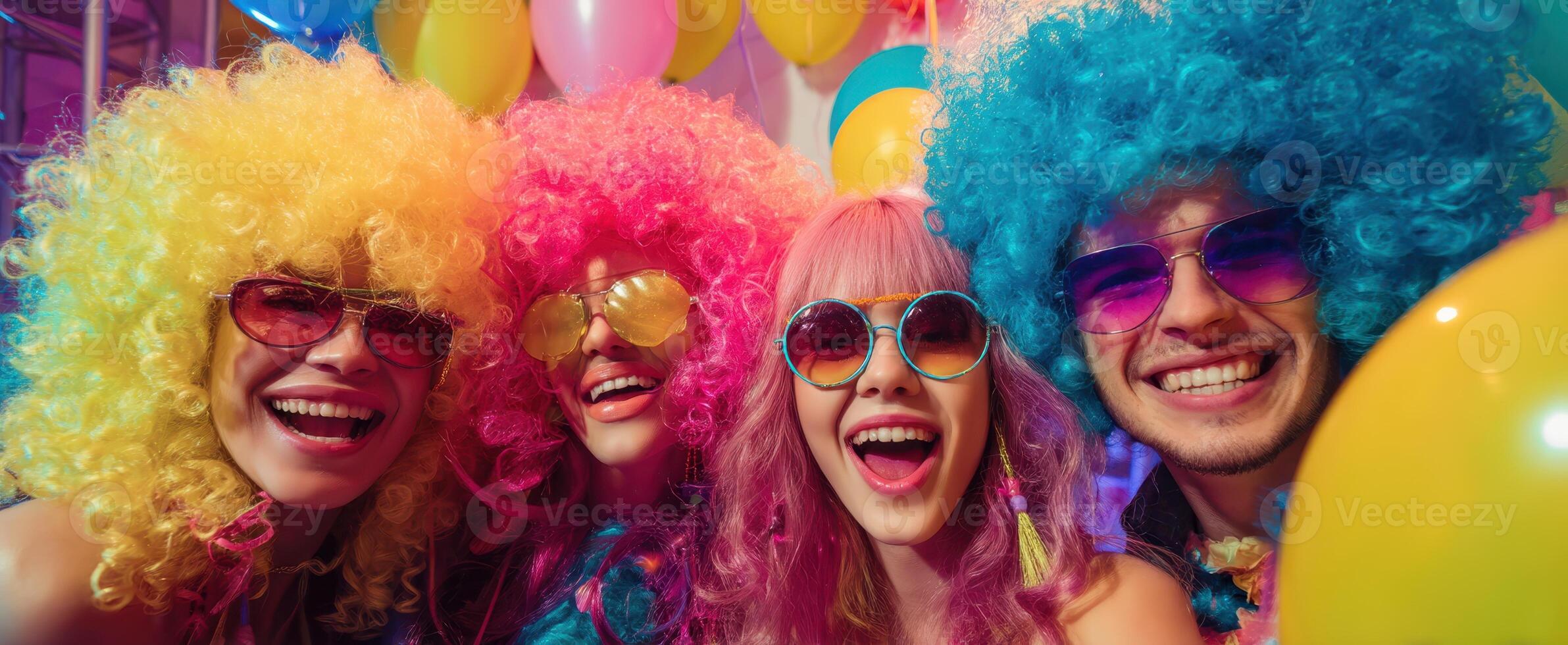 The joyful friends celebrating together in vibrant wigs and colorful accessories. photo