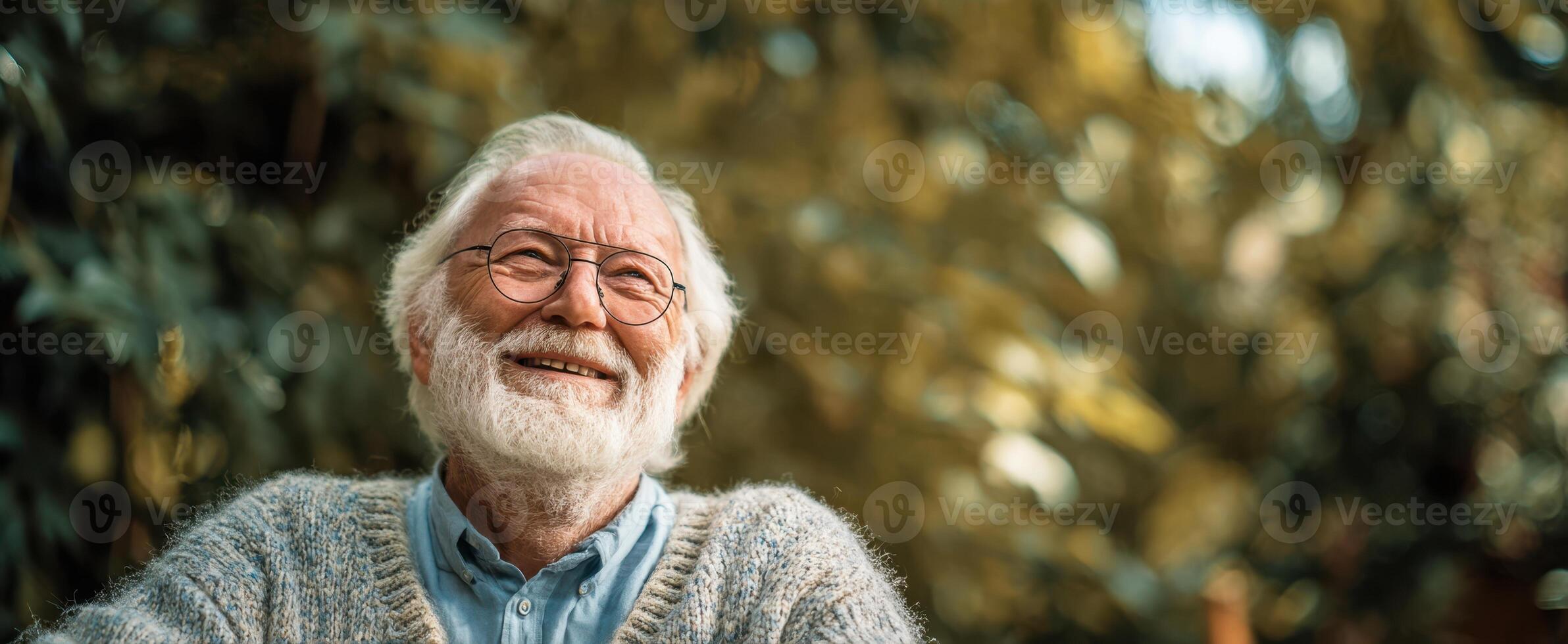 The smiling elderly man enjoying a peaceful moment in nature's embrace. photo